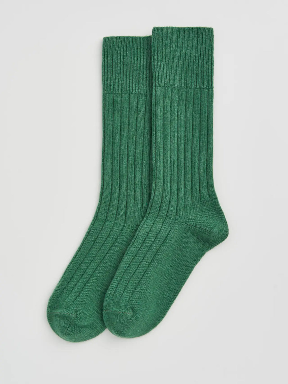 Pair of village green ribbed bed socks laid flat