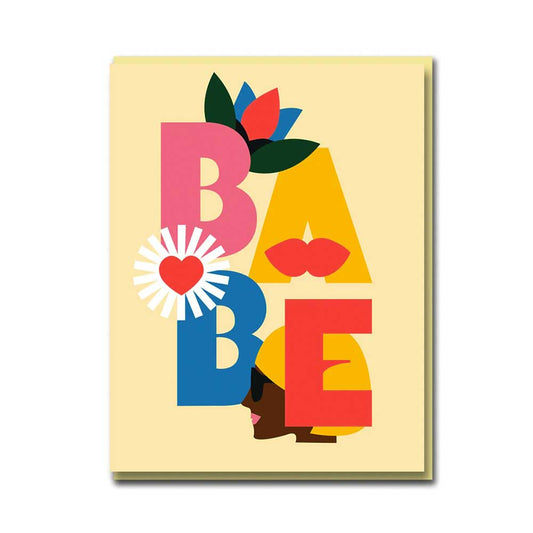 Card with bold colourful letters spelling BABE with a flower and a heart