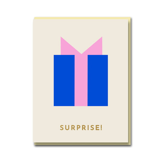 1973 card: a blue present with a pink ribbon, with gold 'Surprise!'