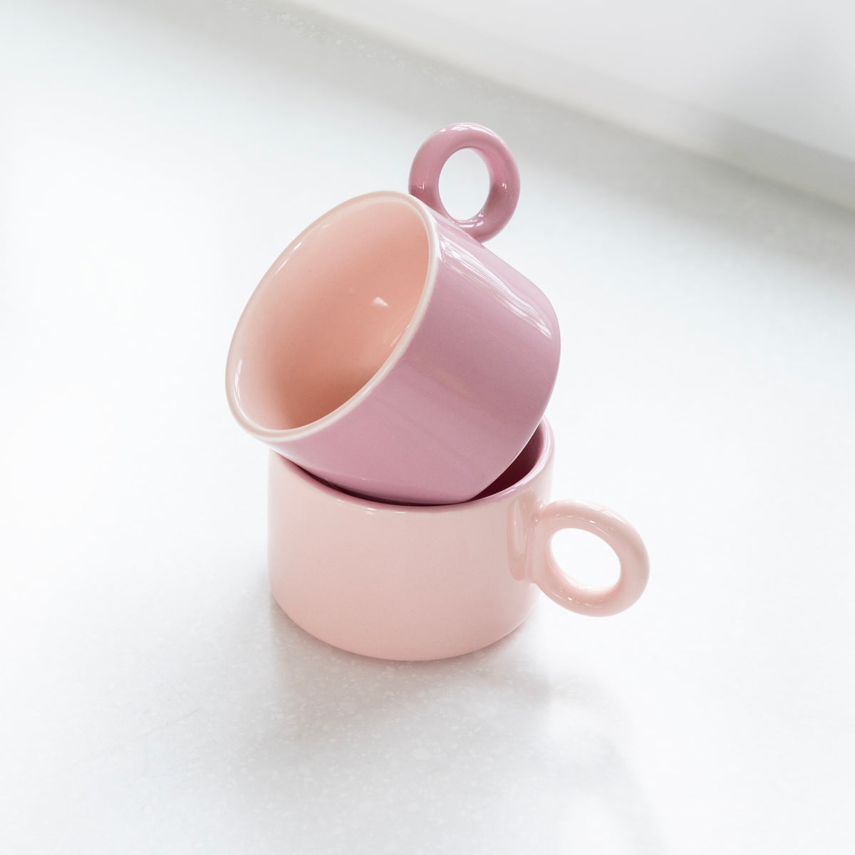 Two pink Chiquito mugs stacked