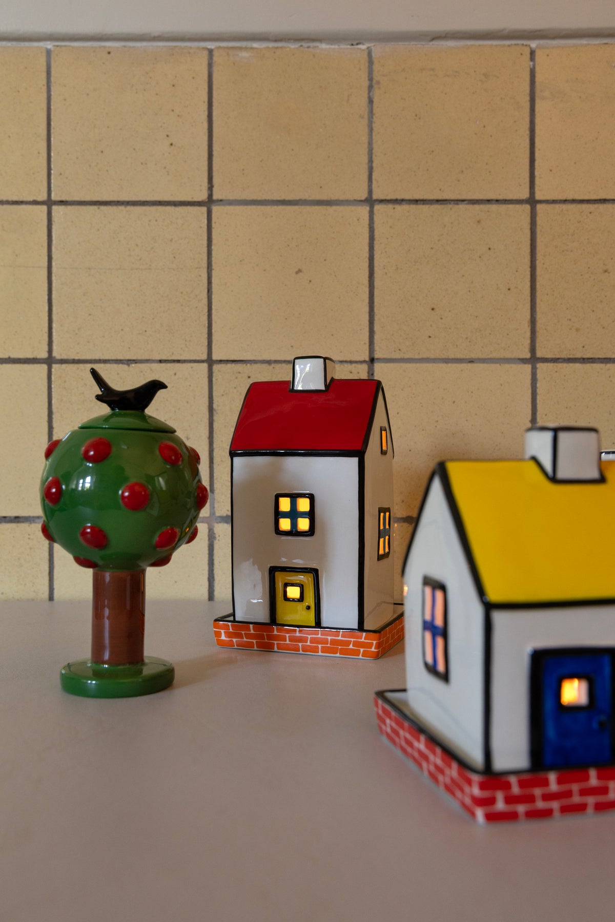 Townhouse tealight holders on a kitchen counter
