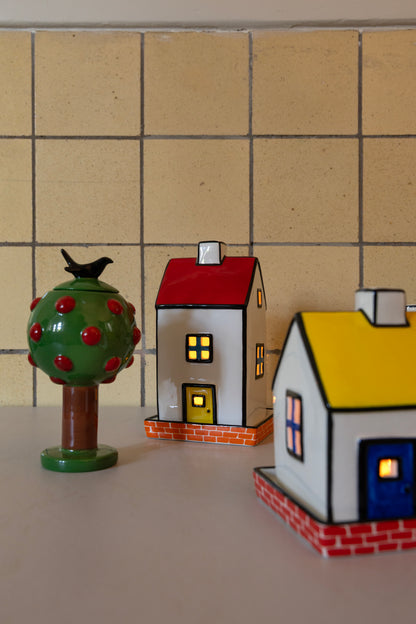 Townhouse tealight holders on a kitchen counter