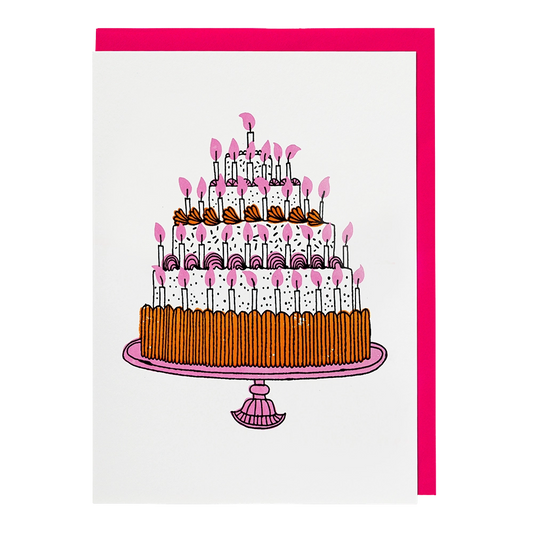 White card with a tall tiered chocolate birthday cake covered in pink candles, with a pink envelope