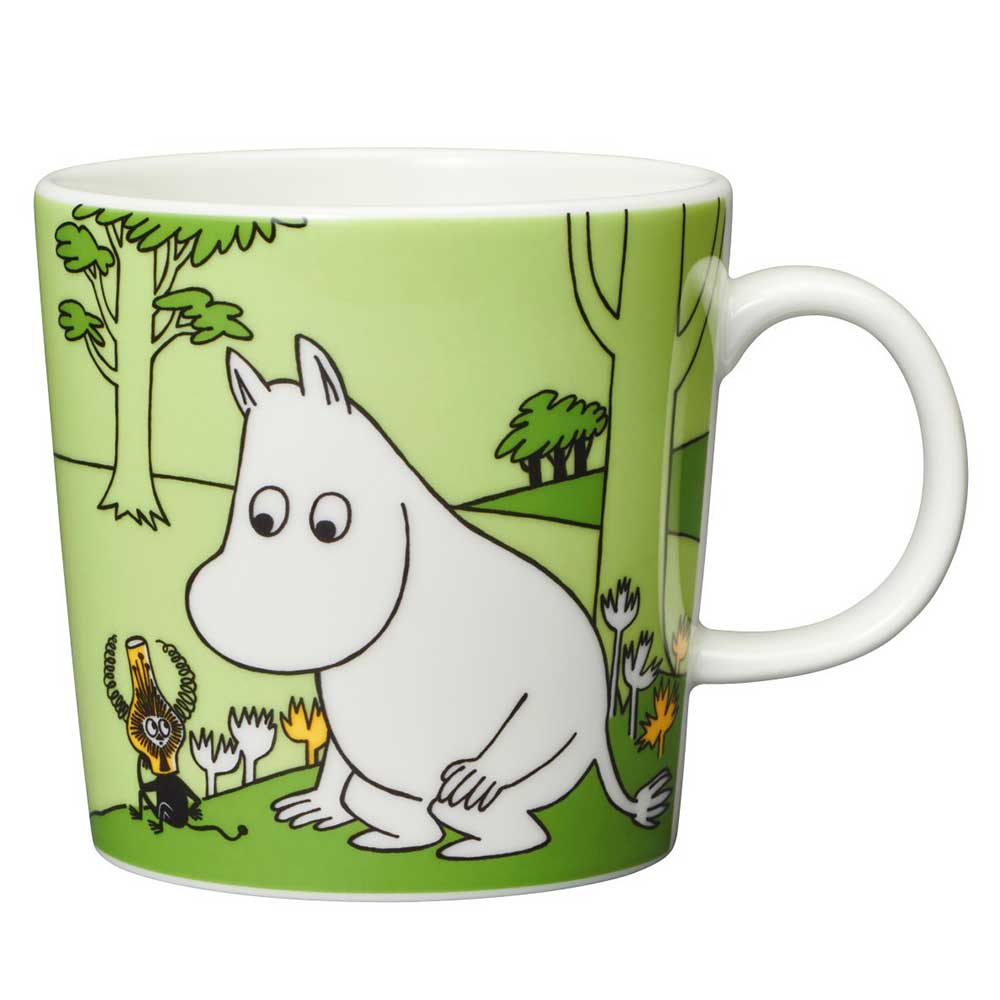 Moomin grass green mug: Moomintroll sitting in the grass looking at a small creature