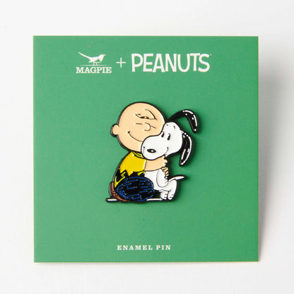 Charlie Brown and Snoopy pin on its green Magpie x Peanuts card