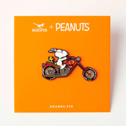 Biker Snoopy pin on its orange backing card