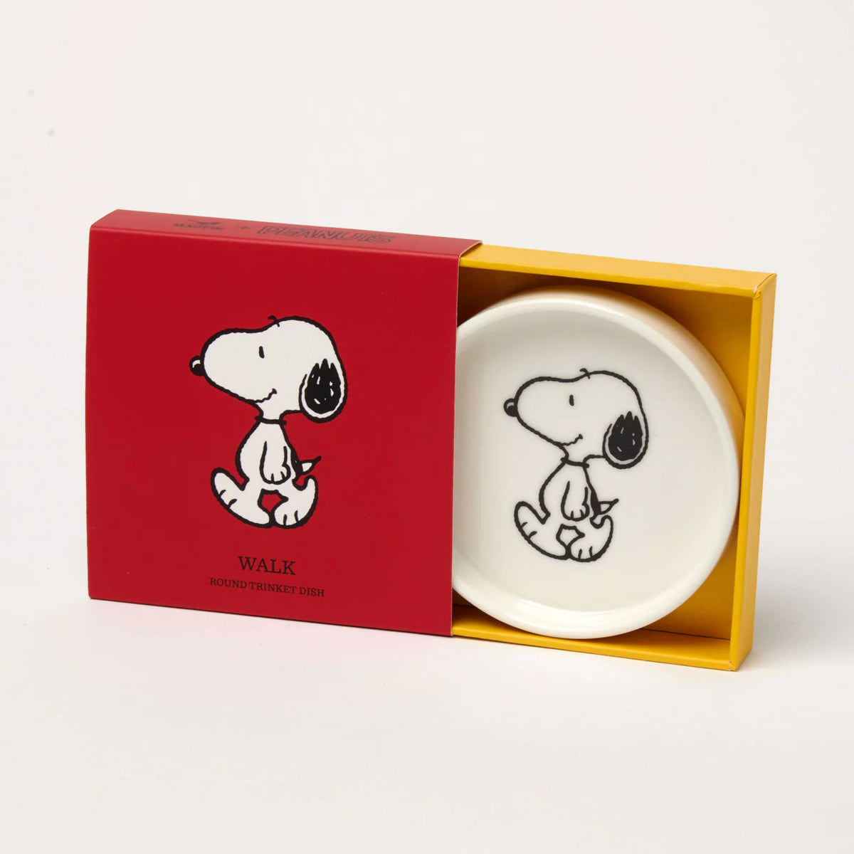 Snoopy trinket dish sitting in its open red and yellow box