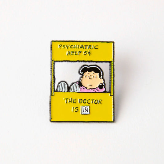 Enamel pin of Lucy's booth: Psychiatric help 5¢, the doctor is in