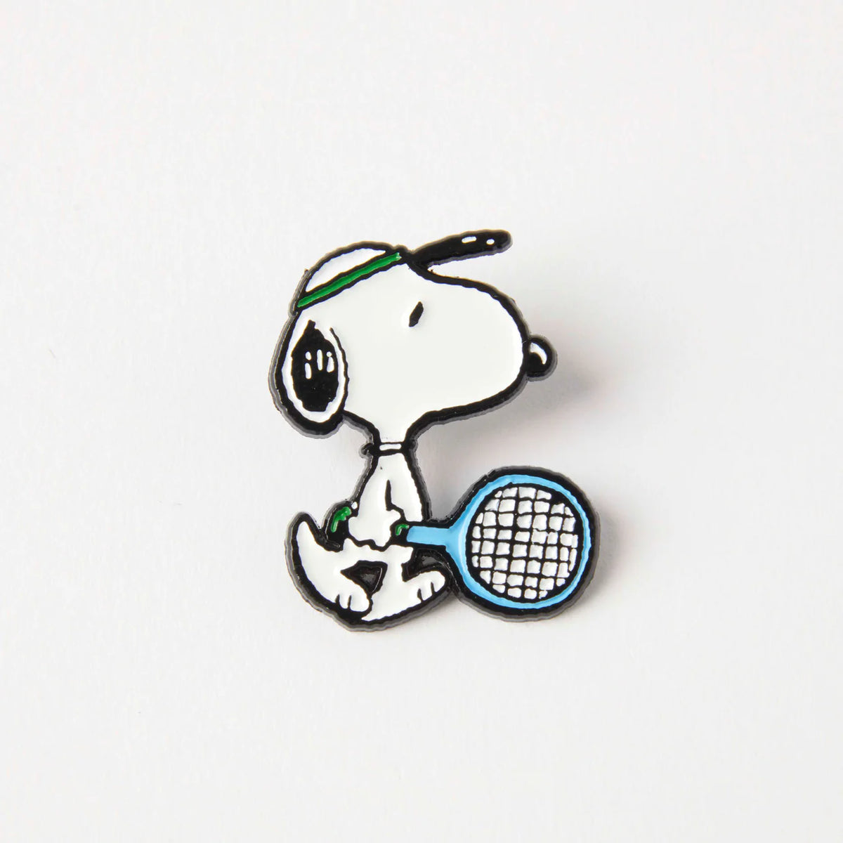 Peanuts tennis enamel pin: Snoopy in a sweatband holding a tennis racket