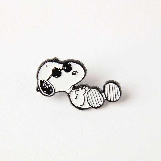 Enamel pin of Snoopy lounging in sunglasses