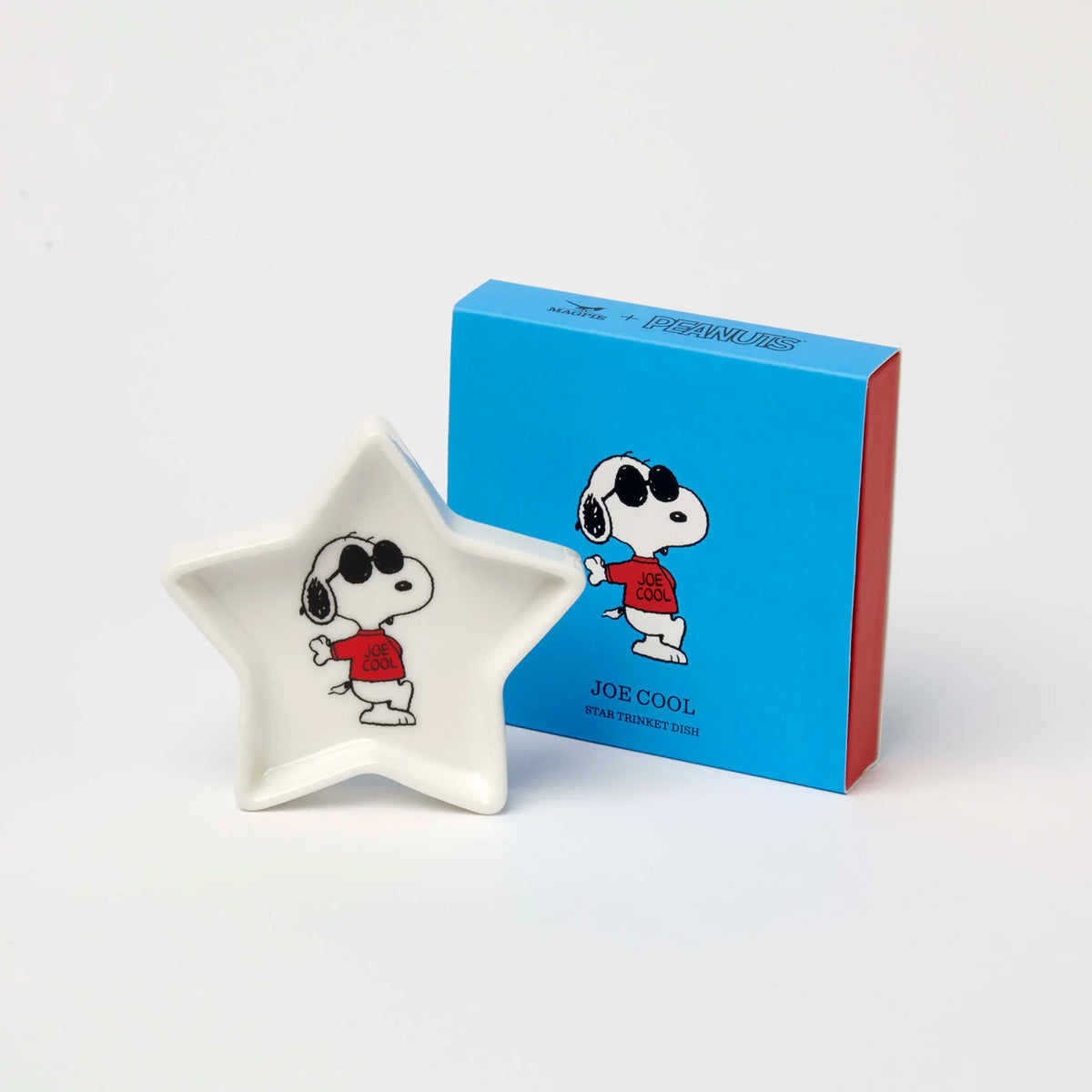 Star-shaped Peanuts trinket dish with Joe Cool Snoopy, beside its blue box