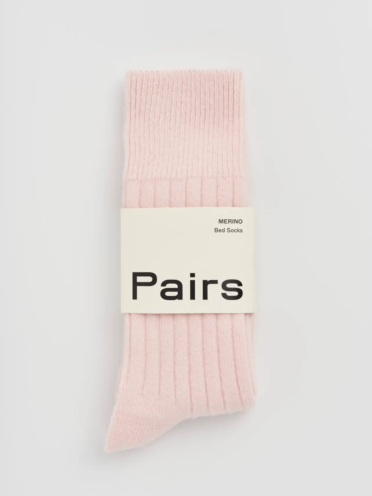 Pairs merino bed socks in frosting pink, small, ribbed, with a Pairs paper band