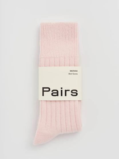 Pairs merino bed socks in frosting pink, small, ribbed, with a Pairs paper band
