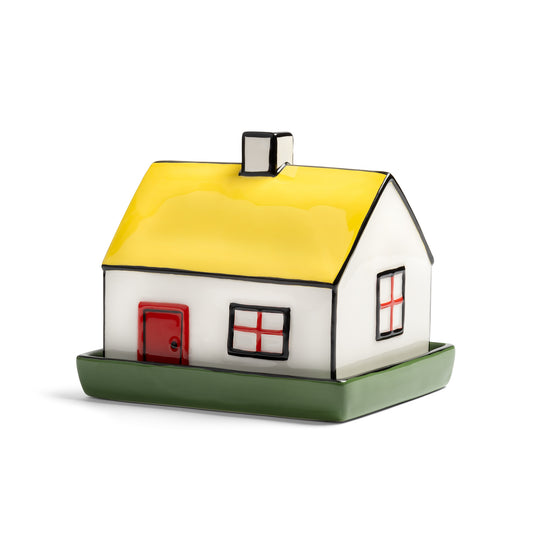 &K Haines house butter dish: a white house with a yellow roof on a green base