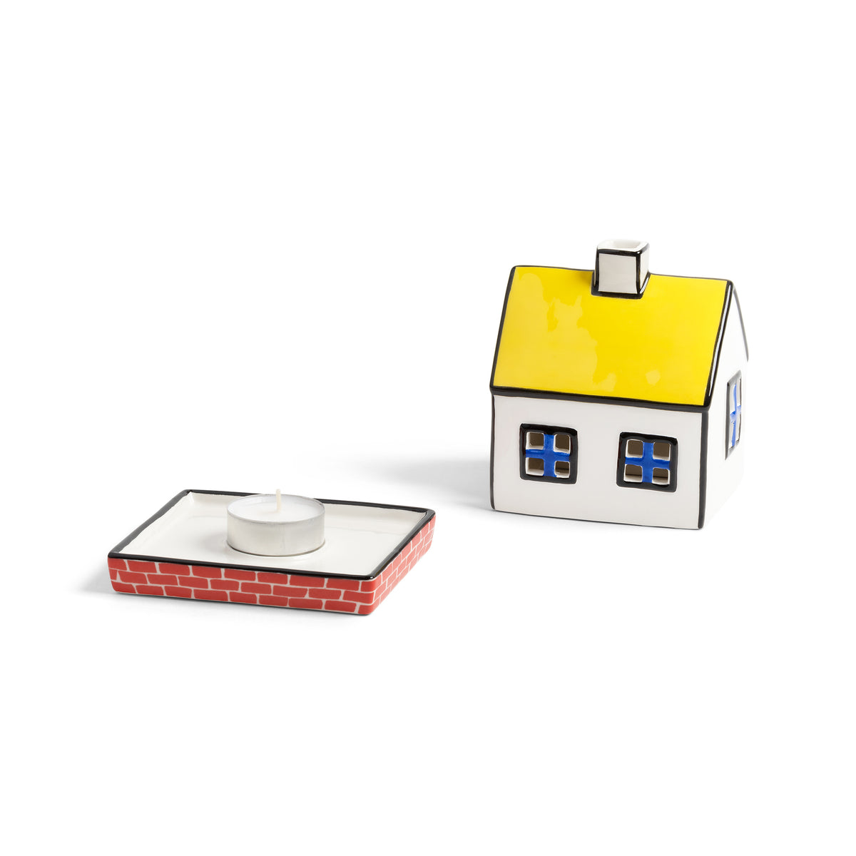 Tealight cottage lifted off its brick base, showing the tealight inside