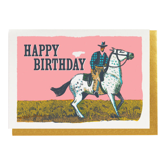 Pink card with a cowboy on a spotted horse: Happy birthday
