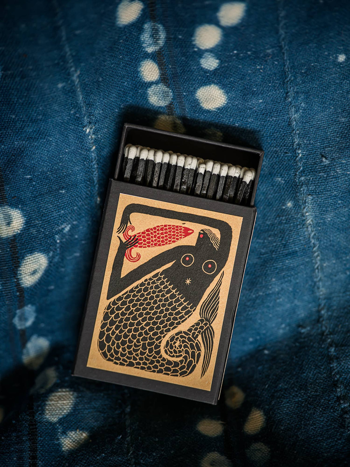 Mermaid keepsake matchbox on blue cloth