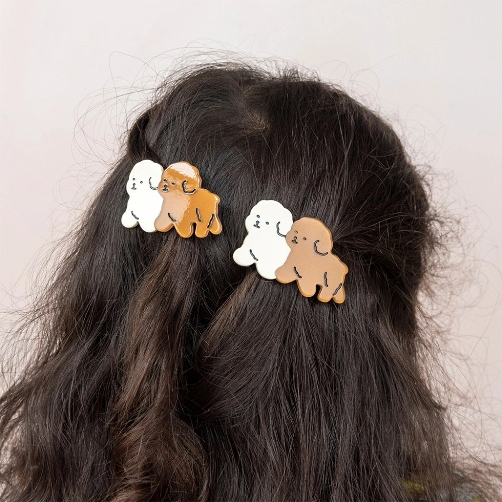 Puppy hair clips worn in dark hair