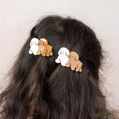 Puppy hair clips worn in dark hair