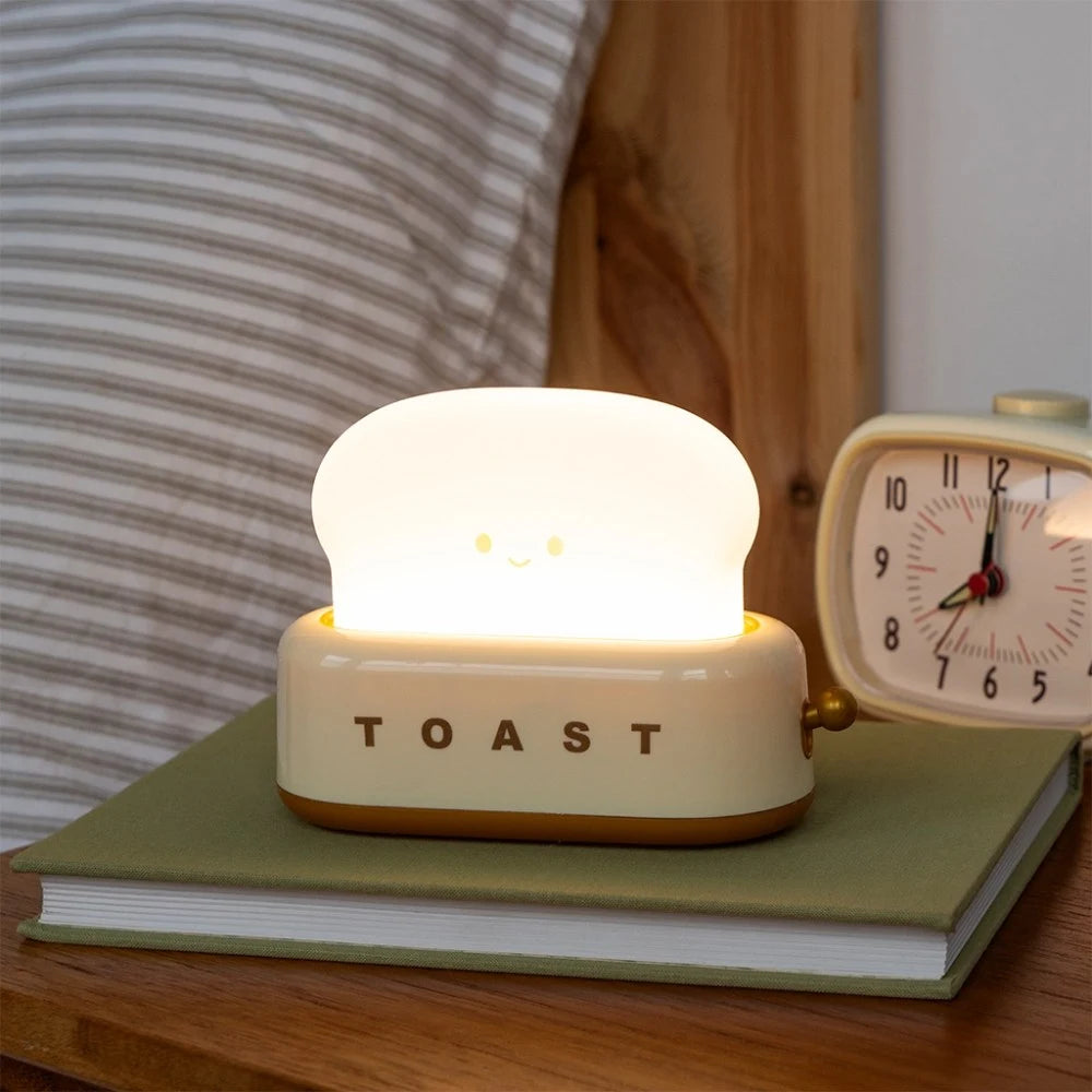 Toaster night light glowing on a bedside table
