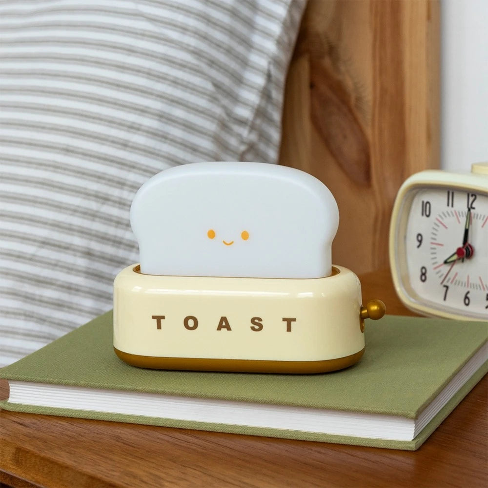 Toaster night light switched off on a bedside table