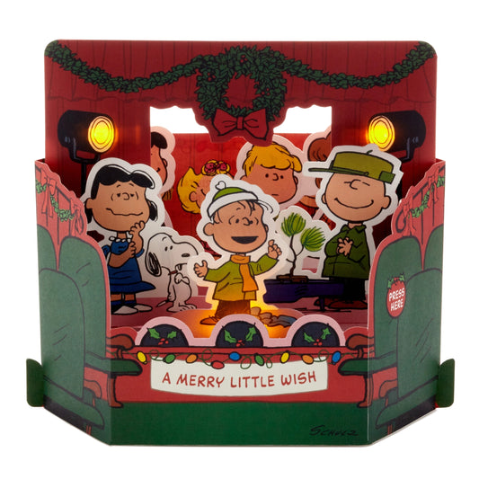 Peanuts pop-up light-up Christmas card: the Peanuts gang singing on a stage, with 'A merry little wish'