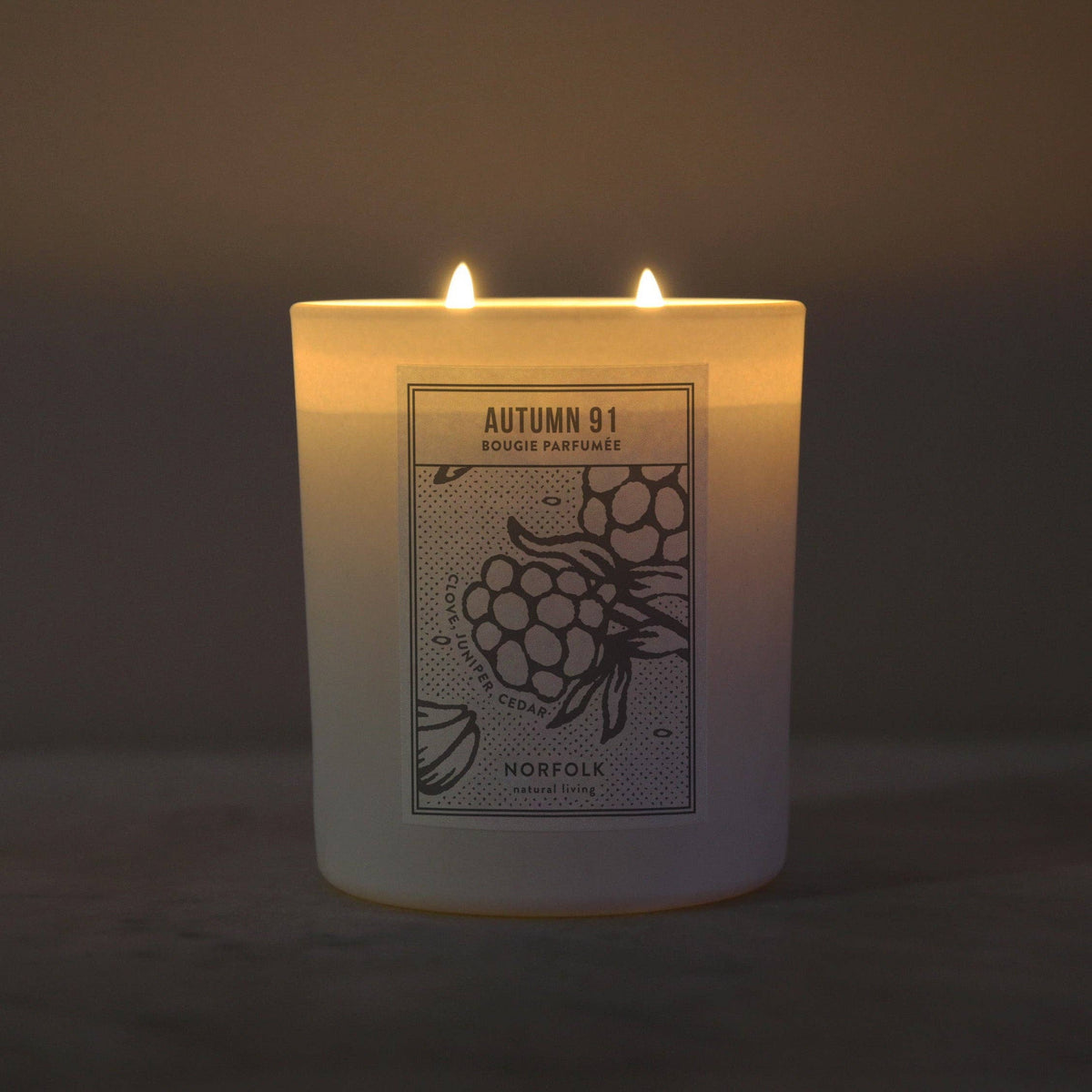 Autumn 91 candle lit in the dark