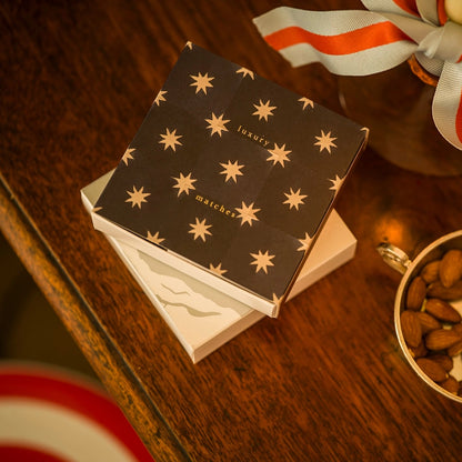Navy star tile matches on a wooden table