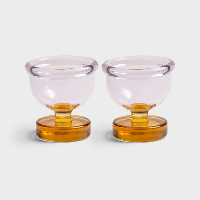 Klevering Cantine egg cups: two pale pink glass cups on amber glass stems