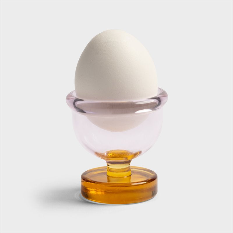 Pink Cantine egg cup holding an egg
