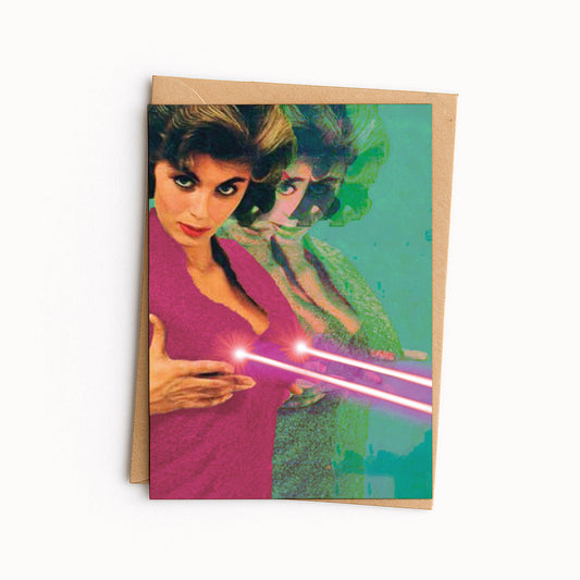 Card of a woman firing laser beams from her chest