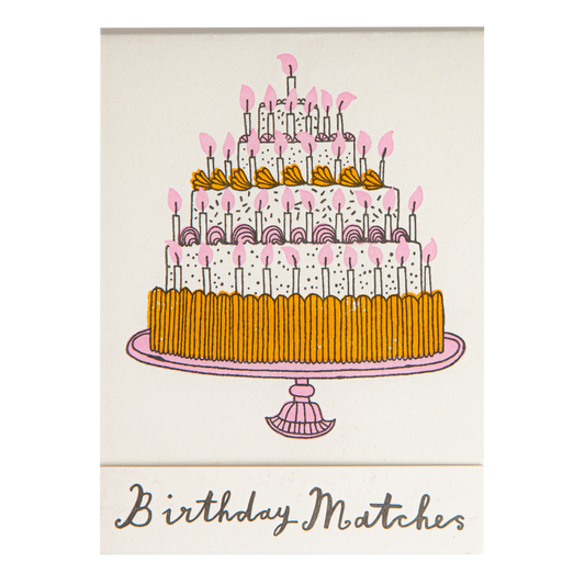 Match book cover: a tall birthday cake with candles: Birthday matches