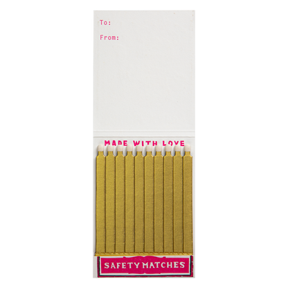 Inside the Double Happy match book with gold matches and a To/From space