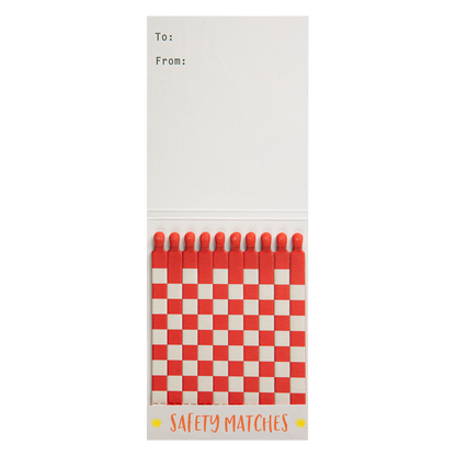 Inside the Sun match book with red and white matches and a To/From space