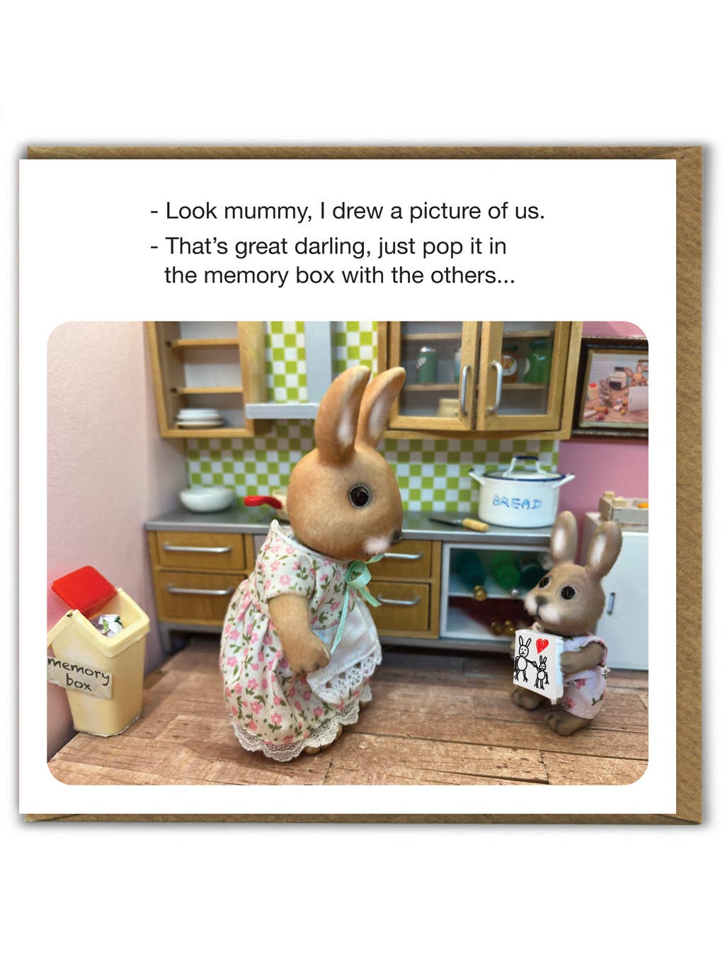 Card of toy rabbits in a kitchen: 'Look mummy, I drew a picture of us.' 'That's great darling, just pop it in the memory box with the others...'