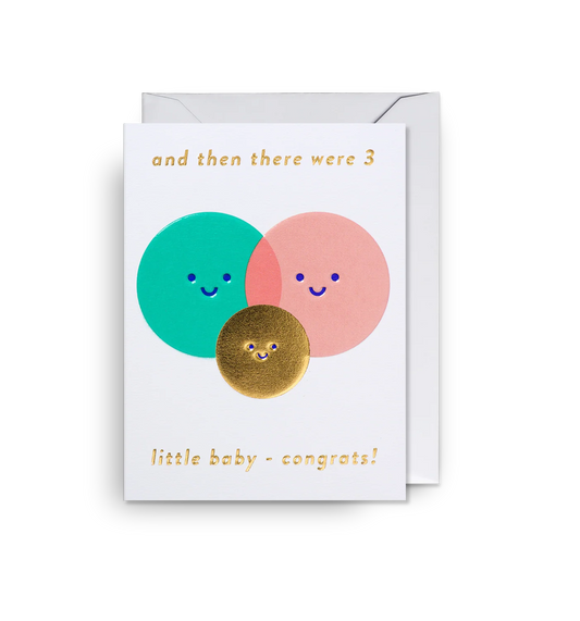 Mini card with teal and pink overlapping circle faces and a gold baby face: and then there were 3, little baby, congrats!