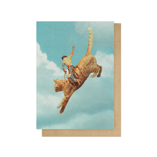 East End Prints card: a cowboy riding a giant leaping ginger cat in the sky