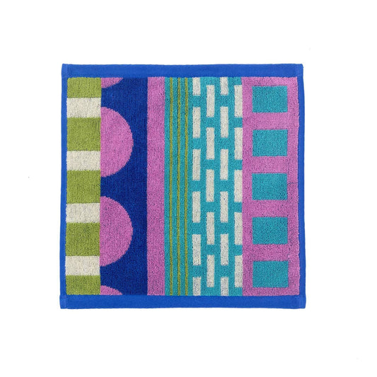 Donna Wilson Circus face cloth with blue, pink, green and white blocks