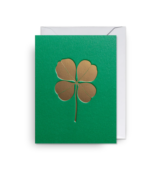 Lagom mini card: a gold four-leaf clover on green