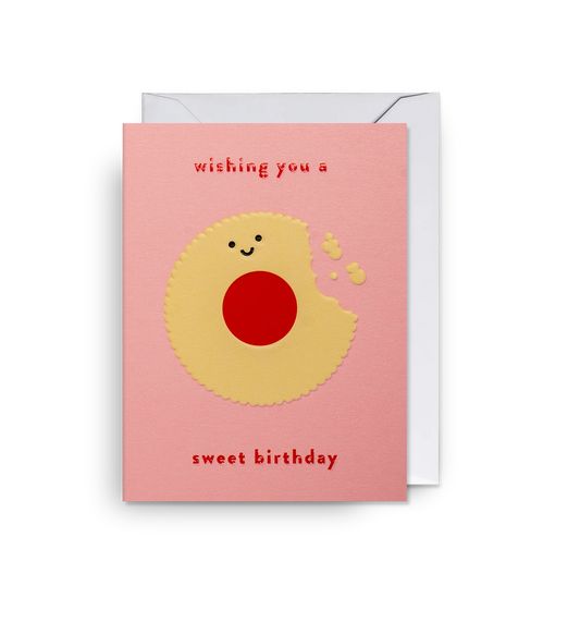 Lagom mini card: a smiling jammy biscuit with 'Wishing you a sweet birthday' on pink