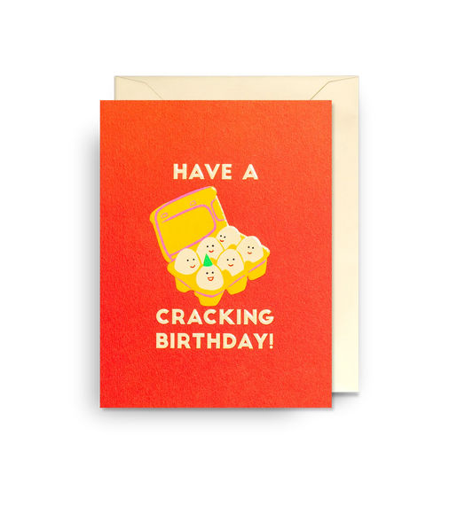 Lagom mini card: a box of smiling eggs on red-orange, with 'Have a cracking birthday!'