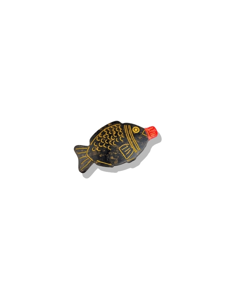 Solar Eclipse brooch shaped like a fish soy sauce bottle with a red cap