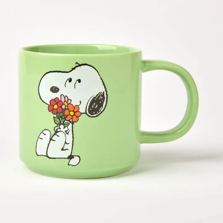 Mint green mug with Snoopy holding a bunch of flowers