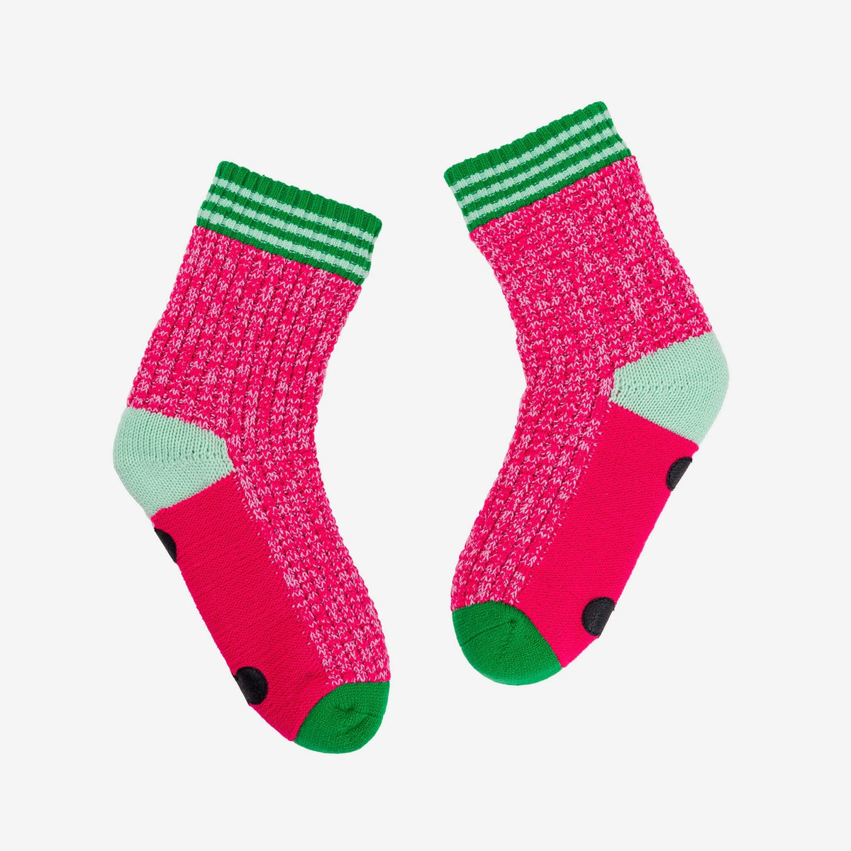 Pink Varsity house socks laid flat, showing the grip dots on the soles