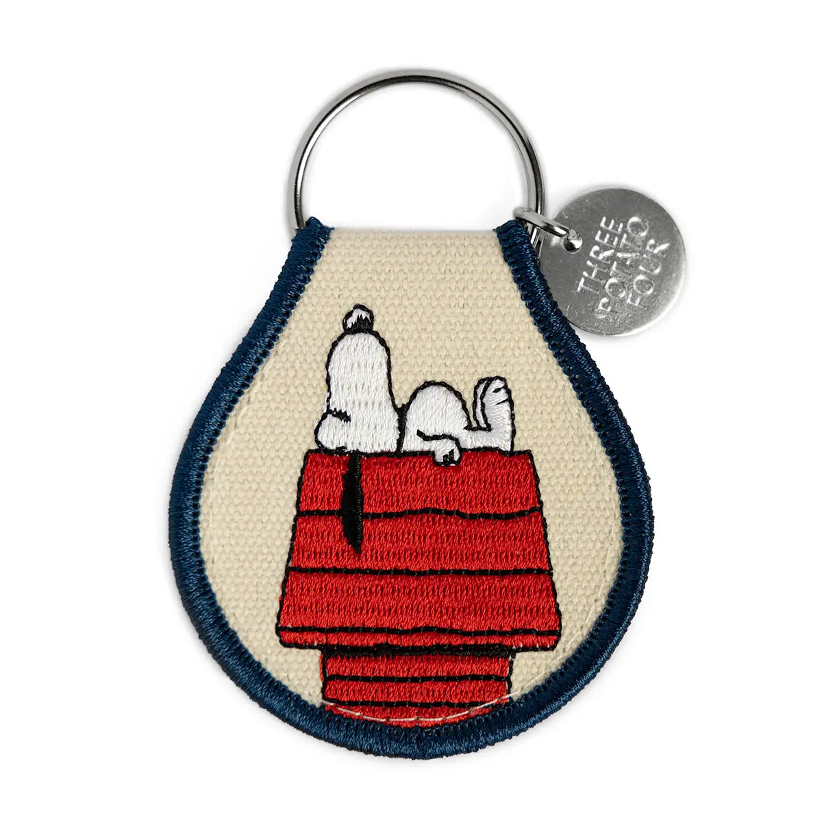 Embroidered Snoopy key ring patch: Snoopy asleep on his red doghouse, with a navy border