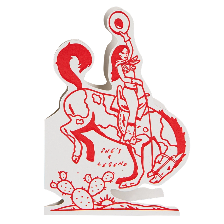 Archivist cut-out card in red and white: a cowgirl on a bucking horse, with 'She's a legend'