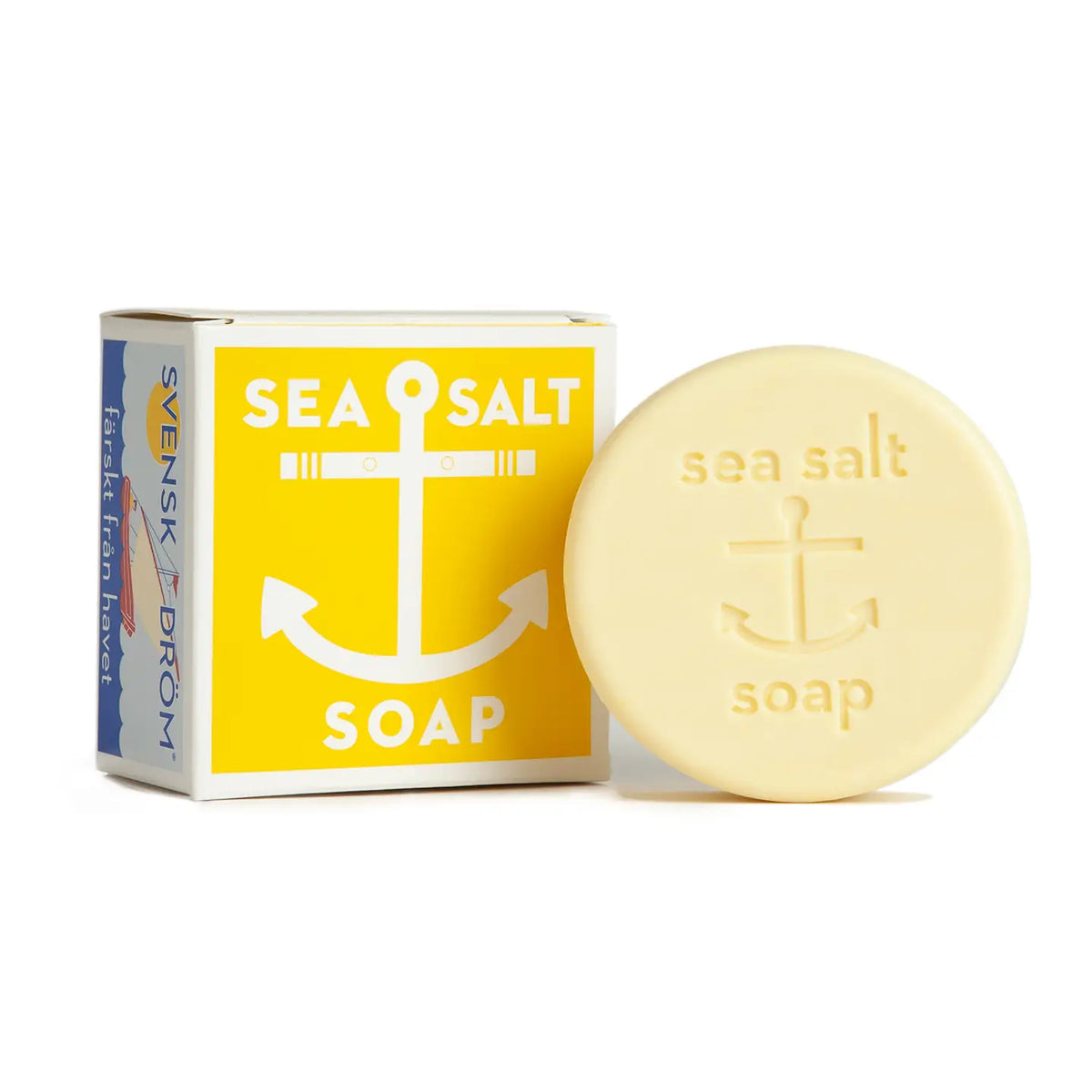 Swedish Dream sea salt soap: a round bar with an anchor beside its yellow box