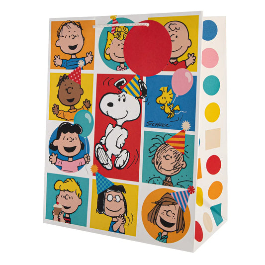 Peanuts large gift bag printed with the Peanuts gang in coloured squares and Snoopy in a party hat