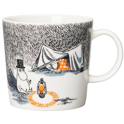 Moomin Sleep Well mug: Moominpappa by a lantern outside a tent at night, in black and white with orange