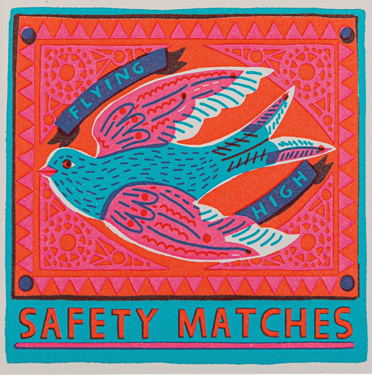 Archivist Flying High safety matches: a swallow with ribbon lettering on a coral background